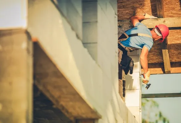 Worker installing something.